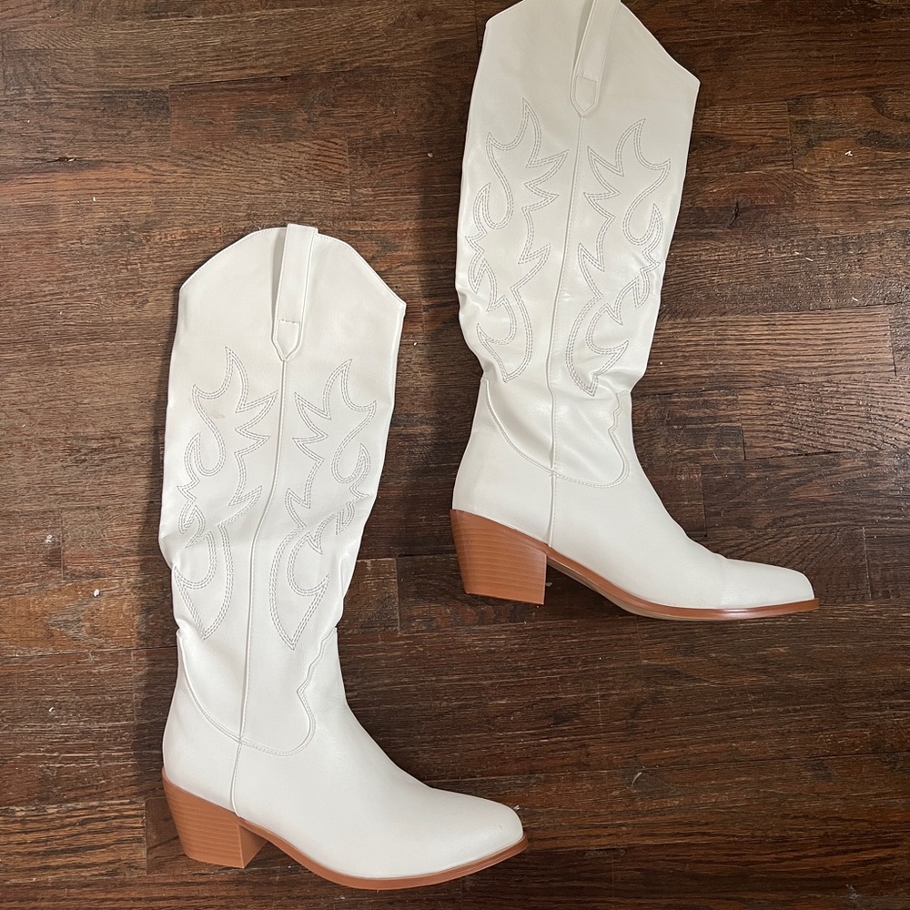 Below the knee white cowboy boots